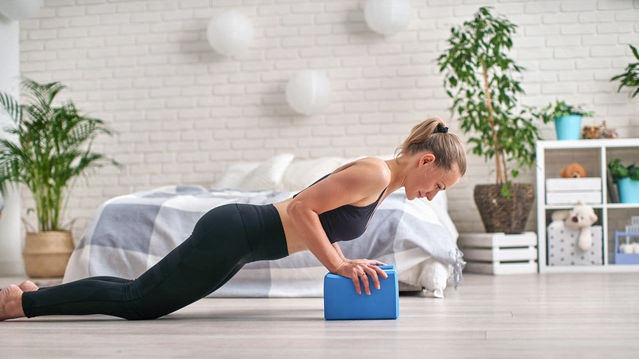 You don't need heavy weights — here's a 5-move ab workout using a yoga block instead