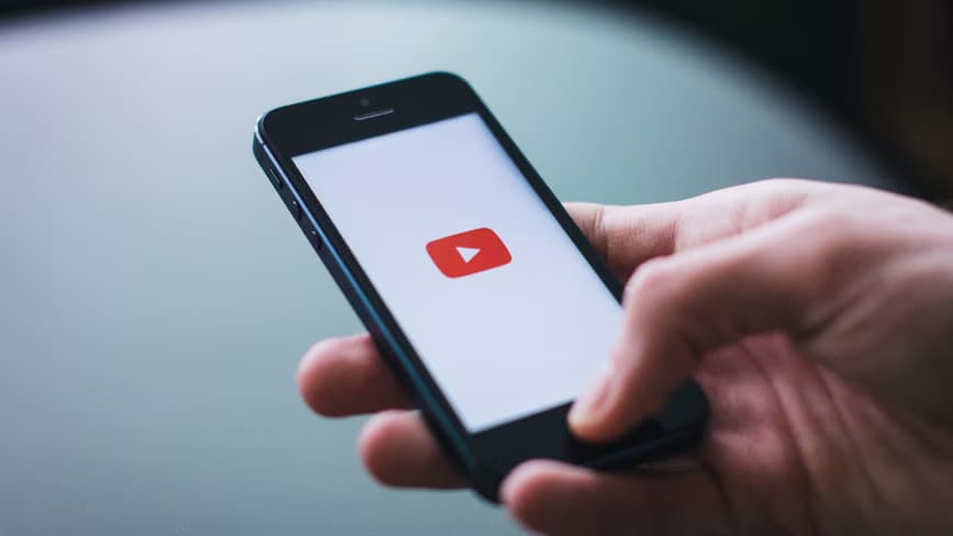 YouTube introduces automatic labeling for AI-generated videos, regardless of creator disclosure.