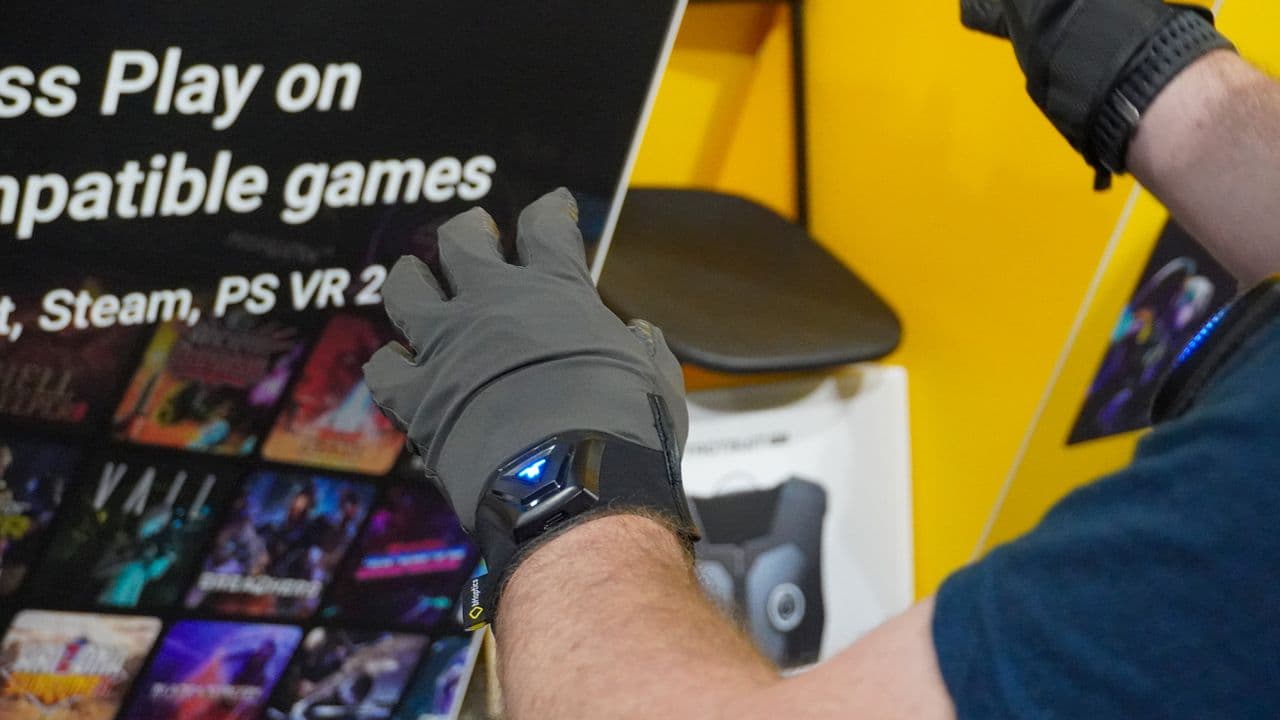 I tried out the latest version of the most advanced haptic VR vest and gloves, and it's more immersive than ever